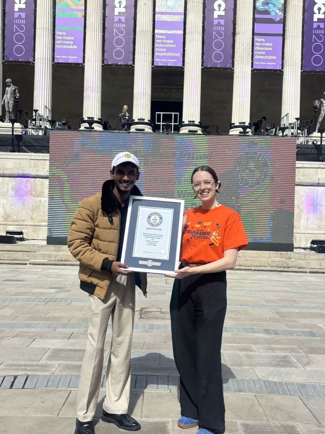 Vasu with the Guinness World Record certificate at UCL, London